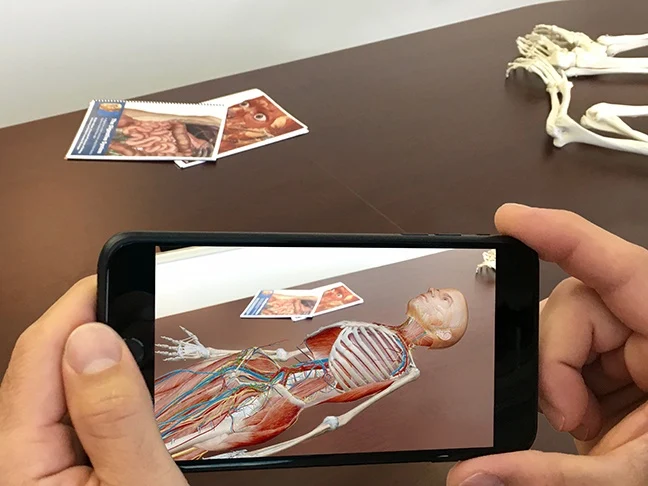 student using augmented reality education app - A Beginner's Guide to Augmented Reality in the Classroom