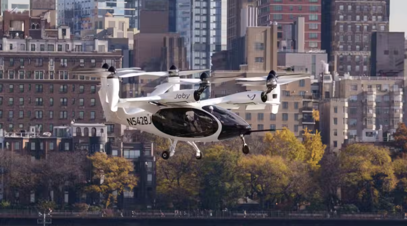 eVTOL aircraft flying over city - Joby — 1st Electric VTOL Aircraft To Fly Over New York City