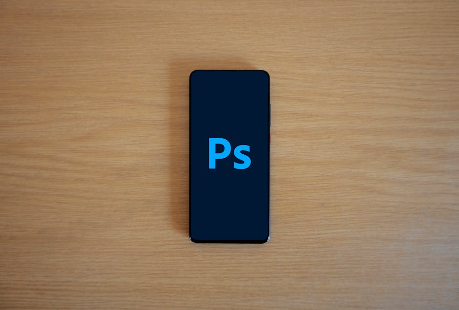 Adobe Photoshop logo on smartphone screen - Adobe Photoshop logo on smartphone screen